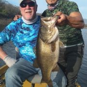 happy angler brags about his big catch of largemouth bass at Picachos lake